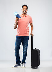 Image showing indian man with travel bag passport and air ticket