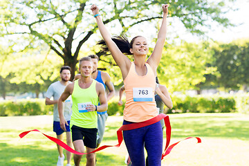 Image showing happy young female runner on finish winning race