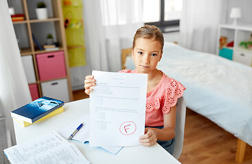 Image showing sad student girl with failed school test at home