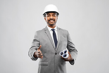 Image showing male architect in helmet giving hand for handshake