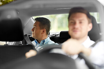 Image showing middle aged male passenger and car driver