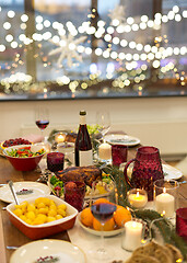 Image showing food and drinks on christmas table at home