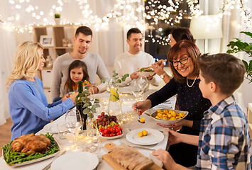 Image showing happy family having dinner party at home