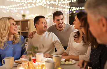 Image showing happy family having tea party at home