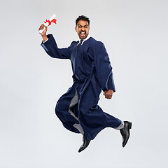 Image showing happy jumping indian graduate student with diploma