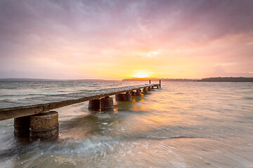 Image showing Sunset sky and long timber jetty