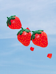 Image showing Strawberry kites flying