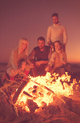 Image showing Friends having fun at beach on autumn day