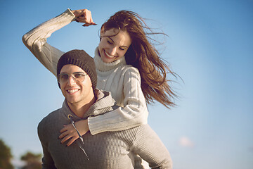 Image showing couple having fun at beach during autumn