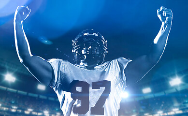 Image showing american football player celebrating after scoring a touchdown