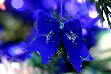 Image showing Christmas ornaments on tree.