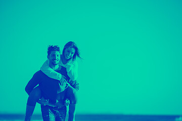 Image showing couple having fun at beach during autumn