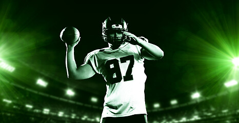 Image showing american football player throwing rugby ball