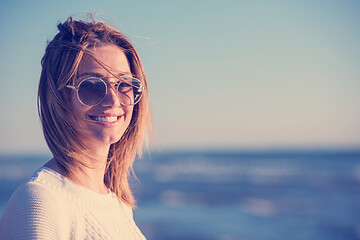 Image showing Young woman enjoying the warm autumn day