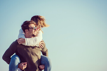 Image showing couple having fun at beach during autumn