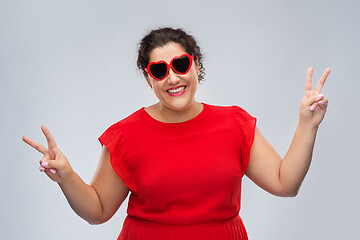 Image showing happy woman in red heart-shaped sunglasses