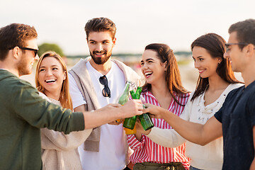 Image showing friends toasting non alcoholic drinks on beach
