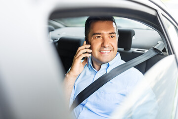 Image showing male passenger calling on smartphone in taxi car