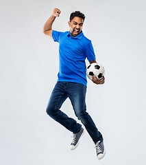 Image showing man or football fan with soccer ball jumping