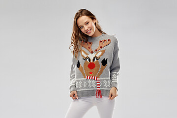 Image showing woman in christmas sweater with reindeer pattern