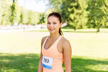 Image showing woman at running marathon with badge number