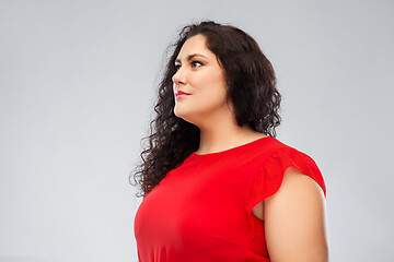 Image showing woman in red dress over grey background