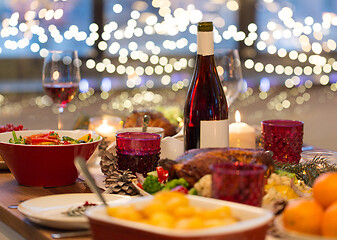 Image showing food and drinks on christmas table at home