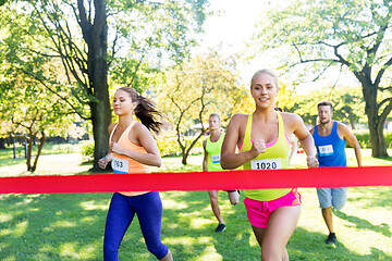 Image showing happy young female runner on finish winning race