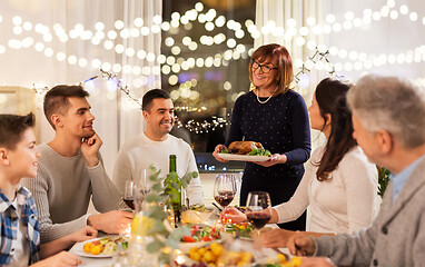 Image showing happy family having dinner party at home