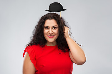 Image showing happy woman in red dress with black bowler hat