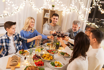 Image showing happy family having dinner party at home