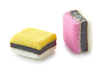 Image showing two pink and yellow candies with licorice