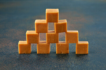 Image showing caramel candies on dark background