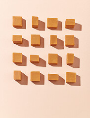 Image showing flat lay composition of caramel candies