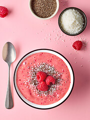 Image showing breakfast smoothie bowl on pink background