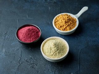 Image showing three various bowls of dried plant powder