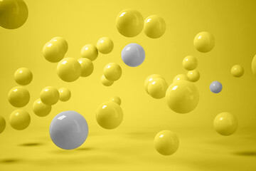 Image showing 3D render of scattered yellow and grey balls levitating on yellow background