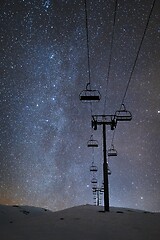 Image showing Ski lift at night under the stars in the sky