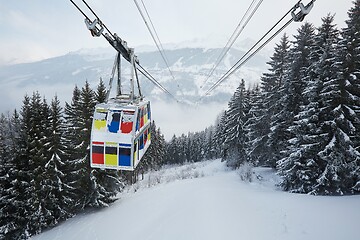 Image showing Skiing lift cabin over a valley