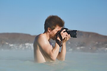 Image showing Enjoying hot spring spa, taking picures