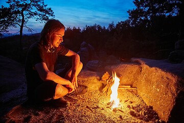 Image showing Man by a campfire