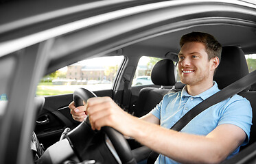 Image showing smiling man or driver driving car