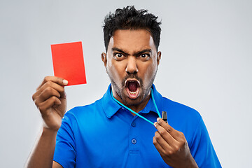 Image showing angry indian referee with whistle showing red card