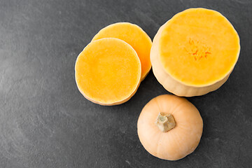 Image showing cut pumpkin on stone background