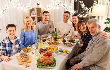 Image showing happy family having dinner party at home