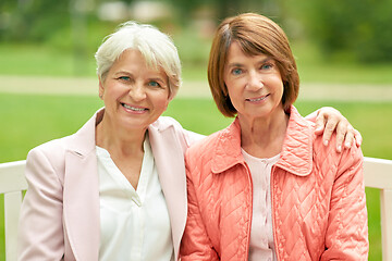 Image showing senior women or friends sitting on bench at park