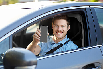 Image showing man or car driver showing smartphone