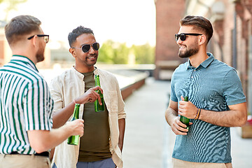 Image showing happy male friends drinking beer at rooftop party