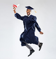 Image showing happy jumping indian graduate student with diploma