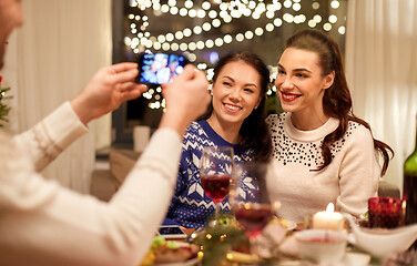 Image showing friends having christmas dinner and taking picture